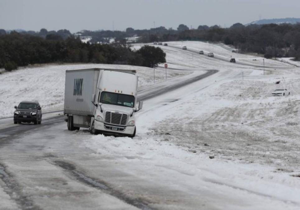 KILLEEN, TEXAS - FEBRUARY 18: A tractor trailer is stuck in the slick ice and snow on State Highway 195 on February 18, 2021 in Killeen, Texas. Winter storm Uri has brought historic cold weather and power outages to Texas as storms have swept across 26 states with a mix of freezing temperatures and precipitation. Joe Raedle/Getty Images/AFP<br/><br/>== FOR NEWSPAPERS, INTERNET, TELCOS & TELEVISION USE ONLY ==<br/><br/>