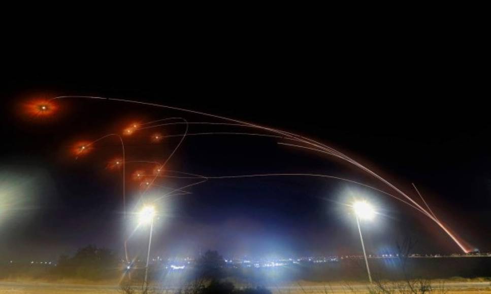 TOPSHOT - Israel's Iron Dome aerial defence system intercepts rockets launched from the Gaza Strip, controlled by the Palestinian Islamist movement Hamas, above the southern Israeli city of Ashkelon, on May 10, 2021. (Photo by JACK GUEZ / AFP)
