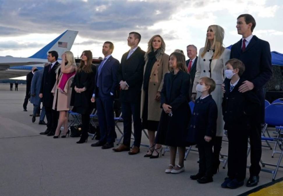 Ivanka Trump (2nd R), husband Jared Kushner (R), their children, Eric (C-R) and Donald Jr. (C-R) and Trump family members stand on the tarmac at Joint Base Andrews in Maryland as they arrive for US President Donald Trump's departure on January 20, 2021. - President Trump travels to his Mar-a-Lago golf club residence in Palm Beach, Florida, and will not attend the inauguration for President-elect Joe Biden. (Photo by ALEX EDELMAN / AFP)