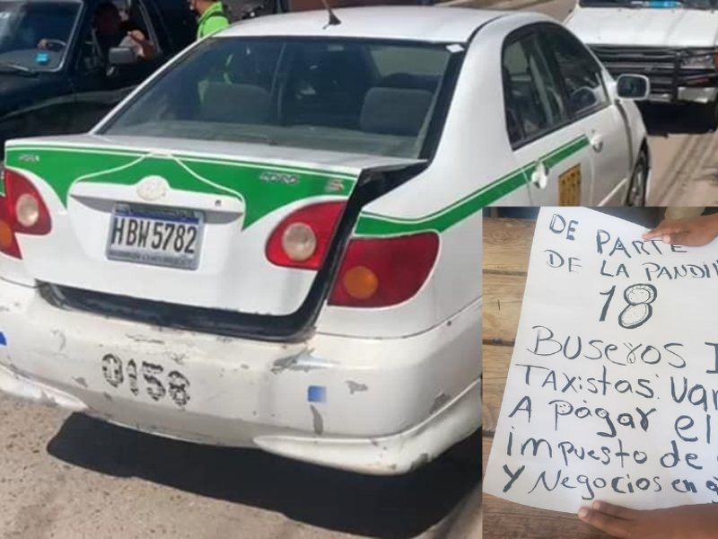 El taxi junto con el cartel que dejaron los sicarios.