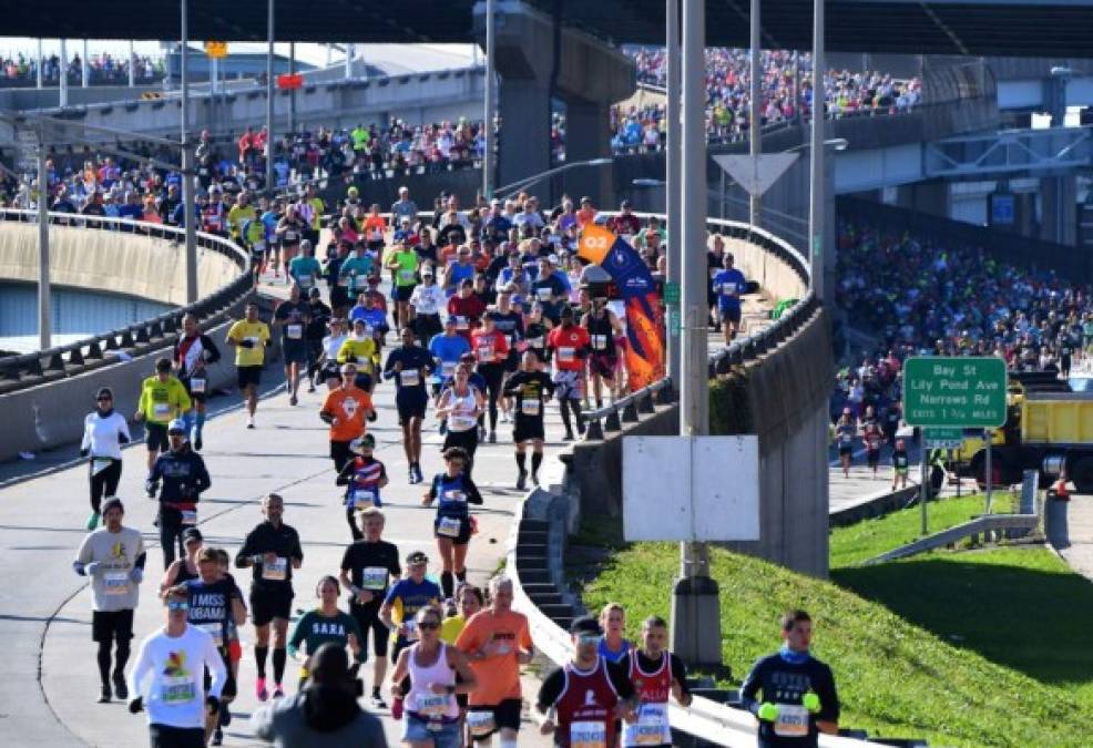 Runners cross the Verrazzano-Narrows Bridge during the 2019 TCS New York City Marathon in New York on November 3, 2019. (Photo by Johannes EISELE / AFP)