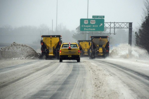 CHAPEL HILL, NC - JANUARY 22: NCDOT snow plows clear the roadway along Interstate 40 during a winter storm on January 22, 2016 in Chapel Hill, North Carolina. A major snowstorm is forecasted for the East Coast this weekend with some areas getting a possible one to two feet of snow. Lance King/Getty Images/AFP== FOR NEWSPAPERS, INTERNET, TELCOS & TELEVISION USE ONLY ==