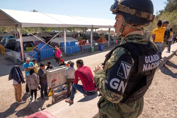 Hundreds of tarps are provided by the Mexican government in the border city of Matamoros as part of its effort to take care of migrants turned back by the United States under the 'Remain in Mexico' initiative. EPA-EFE/CRISTOBAL HERRERA