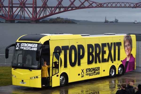 Scotland's First Minister Nicola Sturgeon poses on the steps of the Scotland National Party (SNP) campaign bus as she launches ths SNP campaign bus tour, at Queensferry Crossing in Edinburgh, Scotland on December 5, 2019. - Britain will go to the polls on December 12, 2019 to vote in a pre-Christmas general election. (Photo by ANDY BUCHANAN / AFP)